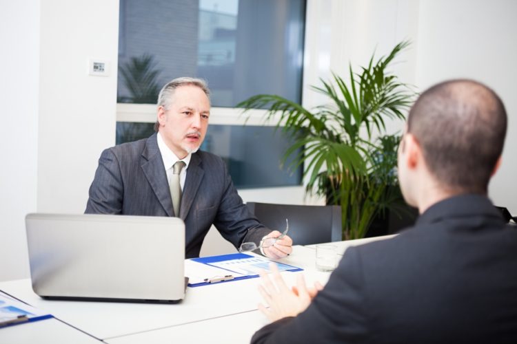 Manager explaining the international banking definition